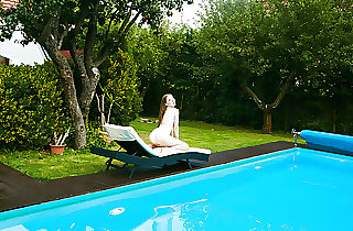 Smallish Russian Marfa swims nude in the pool